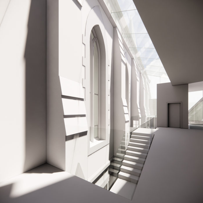 A stair and skylight make a slot between historic church and new parish center.